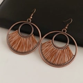 Detail of vintage bronze round earrings featuring brown woven fan-shaped patterns - Hook - Coffee Gold