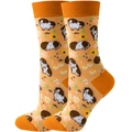 Close-up of orange crew socks featuring cute guinea pig and daisy patterns in high detail - Yellow Marmot