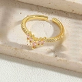 Macro detail of crown-shaped gold adjustable ring with pink marquise and white crystals - Pink Zircon Crown Style