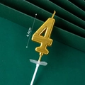 Golden number 4 birthday candle with a height of 4.4cm on a professional green background - Golden Long Number Candle 4
