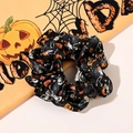 Macro shot of Halloween scrunchie with pumpkin and skull patterns on black fabric - No. 10 Large Scrunchie / Large Size