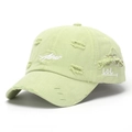 Detail of distressed light green baseball cap with Asher embroidery and metal rings - Light Green