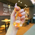 Detail of orange bunny keychain with resin body, glitter filling and bell accessory - Colorful Hardware Keychain Style / Luminous Bubble Beads Tata (Orange)