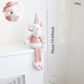 Pink Christmas doll with sequins sitting on a fireplace with warm lights, 50cm tall - Pink Long Legged Reindeer
