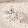 Macro detail of orchid flower ring with brushed silver petals and gold stamen center - Orchid Brushed Texture (Silver) (RZ0869yinse)
