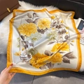 Detailed close-up of floral silk scarf with yellow blooms and bright orange borders - Yellow (W-477)