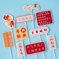 10-piece 2025 graduation cake toppers set with motivational quotes on blue background - God of Exams