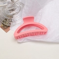 Detail of matte pink hollow claw clip on white textured paper with decorative background - Semi-circle / Girl Pink