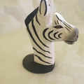 Hand-painted wooden zebra eyeglass holder with black and white stripes on a round base - Zebra