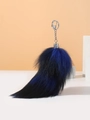 Detail of blue and black gradient fox tail keychain with silver metal clasp - Black and Blue