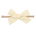 Detail of soft nylon infant headband with a light yellow textured fabric bow on white background - Pale Yellow (5)