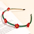 Detail of a thin gold headband featuring green beads and red crystal flower embellishments - 28# Red Woven Small Flower Thin Headband