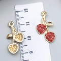 DIY cherry pendant with gold texture and red crystal variants shown next to a ruler - Red Rhinestone Cherry (23422)