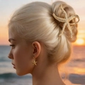 Golden starfish hair claw and earrings set worn by a model on a sunset beach background - 7cm / Small Gold Starfish