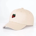 Close-up of strawberry embroidery detail on cotton baseball cap for kids - One Size / Beige