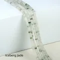 2x4mm Iceberg Jade cylindrical beads featuring a white base with vivid green speckles - 2x4mm Spacer Beads (Approx. 150 Beads/Strand) / Iceberg Jade