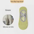 Calze da yoga verdi in cotone con gommini antiscivolo e fasce elastiche incrociate - Taglia unica / Verde Smeraldo