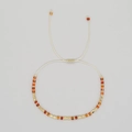 Handmade beaded bracelet featuring orange agate stones and gold spacers with sliding knot - Orange Red