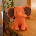 Orange plush elephant doll for baby soothing, soft sitting toy with large grey ears - Orange