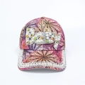 Detailed view of pink floral baseball cap featuring Baby lettering in pearls and rhinestones - Adjustable / Purple BABY