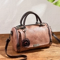 Retro Boston pillow handbag in dusty rose leather with floral charm and shoulder strap - Dusty Pink