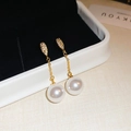 Detail of long gold pearl earrings with micro-inlaid zircon and elegant metal chain - Gold Thin Bar Micro-set Rhinestone Long Pearl Earrings