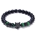 Detail of wolf head charm with green tiger eye and black matte beads bracelet - Green Tiger Eye Style