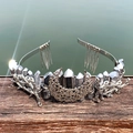 Detailed view of silver crystal crown featuring intricate metal moon and branch texture - Silver
