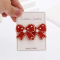 Bohemian bow-shaped seed bead earrings with red beads and white pearl accents - Red Bow Seed Bead Earrings