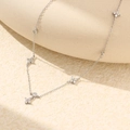 Elegant S925 silver necklace with five sparkling zircon-set clover pendants in silver - 925 Silver / White Gold