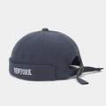 Detail of NEW YORK white embroidery and metal buckle on navy blue brimless docker cap - Adjustable / Dark Gray