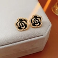 Close-up of elegant black rose stud earrings with gold edges and sparkling crystals - Camellia Stud Earrings - Black (Silver Earring Post)