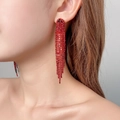 Elegant long red rhinestone tassel drop earrings shown on a model for a stylish look - 3D Style / Red