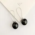 Elegante lange Silberhaken-Ohrringe mit glänzenden schwarzen Perlen für Damenmode - Schwarze Perle/Langer Silberner Haken