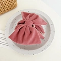 Close-up of velvet bow hair claw with elegant pearl detail in dusty rose finish - Velvet Bowknot / Pink