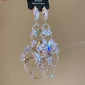 Macro shot of multi-layered hollow flower drop earrings with sparkling AB crystals - Gold-AB Rhinestones