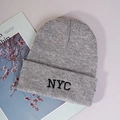Detailed close-up of grey knitted beanie featuring black NYC embroidery and thick texture - One Size / Gray