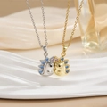 Detail of hedgehog charms in gold and silver plating with blue and pink rhinestones - Cartoon Dinosaur