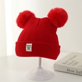 Red knit baby winter hat with double pom-poms and minimalist woven label on white stand - 3-24 Months (45-50CM) / Red