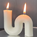 White minimalist S-shaped scented candle with ribbed texture and double wicks lighting up - Large S-Shape / 10x10x5cm Box / White