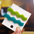 Set of two wavy leopard print hair clips in green and teal resin on a white card - 2# Wavy Hair Clips Set (Blue-Green/Grass Green)