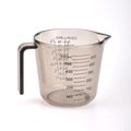 Transparent 600ml plastic measuring cup with handle and clear metric scale markings - 600ml Brown
