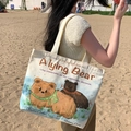 Cream canvas tote bag with cartoon bear illustration and shoulder strap for casual style - Fat Bear