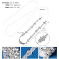 Macro detail of bridal belt with rhinestones and pearls on satin ribbon with dimensions - Silver