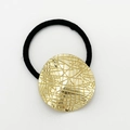 Minimalist elastic hair tie featuring a polished golden textured metal heart pendant - Shiny Gold - Grid Round