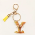 Detail of bee letter Y keychain with yellow tassel and honeycomb acrylic pendant - Letter Y