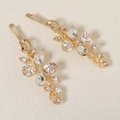 Detail of gold floral hair clips featuring delicate rhinestones and metallic leaf patterns - HS-J6597G