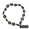 Dettaglio di perline occhio del diavolo nere da 6mm con sfere dorate su cordino elastico - Nero