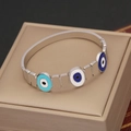 Silver stainless steel bangle featuring four colorful enamel evil eye charms for women - Four-color Evil Eye (2#)