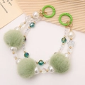Green plush fur ball and white pearl beaded phone wrist strap with gold accents - Green Double Chain Style (K112)
